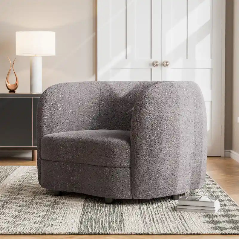 Fauteuil d'appoint moderne en bouclette, accoudoirs incurvés, assise réniforme, pieds ronds en bois, blanc cassé